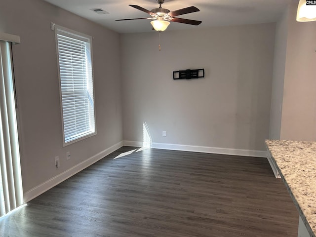 739 Jacobs Mill Pond Rd Unit 21, Elgin, SC 29045 - unfurnished room with a ceiling fan, dark wood finished floors, and baseboards