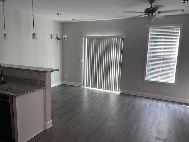 739 Jacobs Mill Pond Rd Unit 21, Elgin, SC 29045 - unfurnished living room featuring ceiling fan, dark wood finished floors, baseboards, and a chandelier