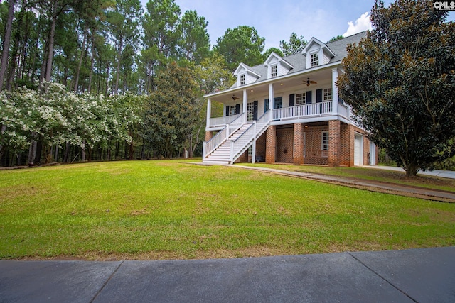2492 Harbor View Rd, Camden, SC 29020 - view of front facade featuring a ceiling fan, stairway, a porch, a front yard, and driveway