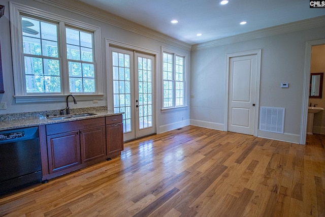 2492 Harbor View Rd, Camden, SC 29020 - kitchen featuring black dishwasher, a sink, ornamental molding, baseboards, and light wood-style flooring