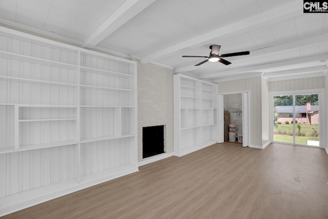 1605 Overhill Rd, Columbia, SC 29223 - unfurnished living room with wood finished floors, built in shelves, ceiling fan, beam ceiling, and a fireplace