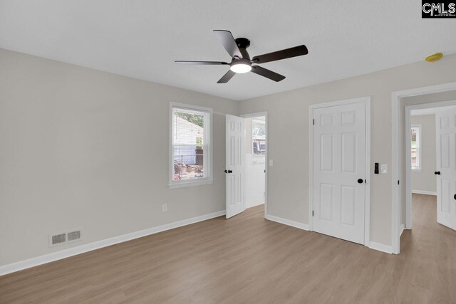 1605 Overhill Rd, Columbia, SC 29223 - unfurnished bedroom with light wood-type flooring, baseboards, and a ceiling fan