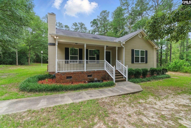 1149 Pond Branch Rd, Gilbert, SC 29054 - view of front facade featuring a porch, a chimney, crawl space, and a front yard