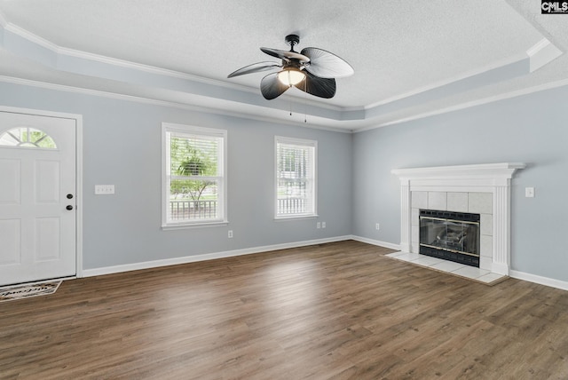 1149 Pond Branch Rd, Gilbert, SC 29054 - unfurnished living room featuring a raised ceiling, crown molding, ceiling fan, wood finished floors, and a textured ceiling