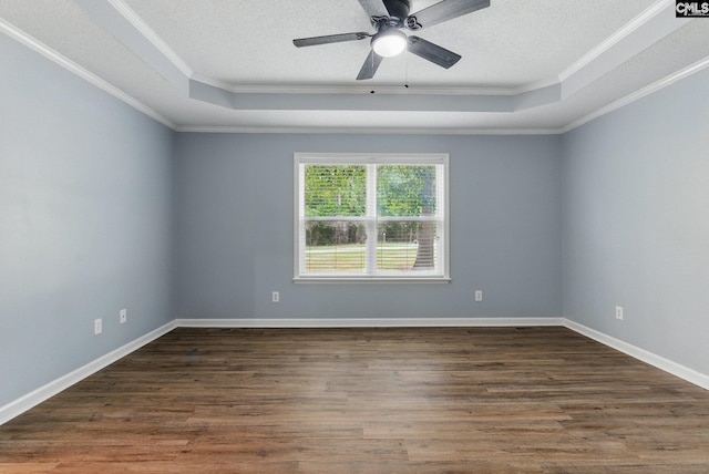 1149 Pond Branch Rd, Gilbert, SC 29054 - spare room with a tray ceiling, ornamental molding, dark wood-type flooring, a textured ceiling, and ceiling fan