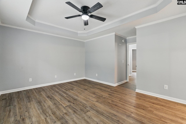 1149 Pond Branch Rd, Gilbert, SC 29054 - unfurnished room with a raised ceiling, ceiling fan, dark wood-style floors, baseboards, and crown molding