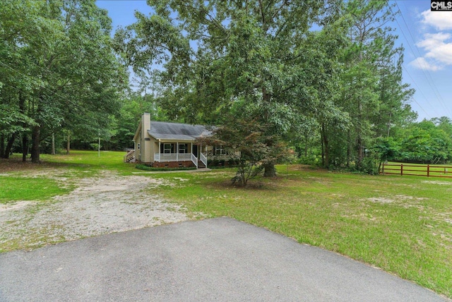 1149 Pond Branch Rd, Gilbert, SC 29054 - view of front facade featuring a chimney, a porch, and crawl space