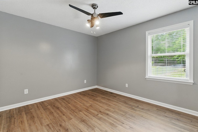 1149 Pond Branch Rd, Gilbert, SC 29054 - unfurnished room featuring a ceiling fan, wood finished floors, and baseboards