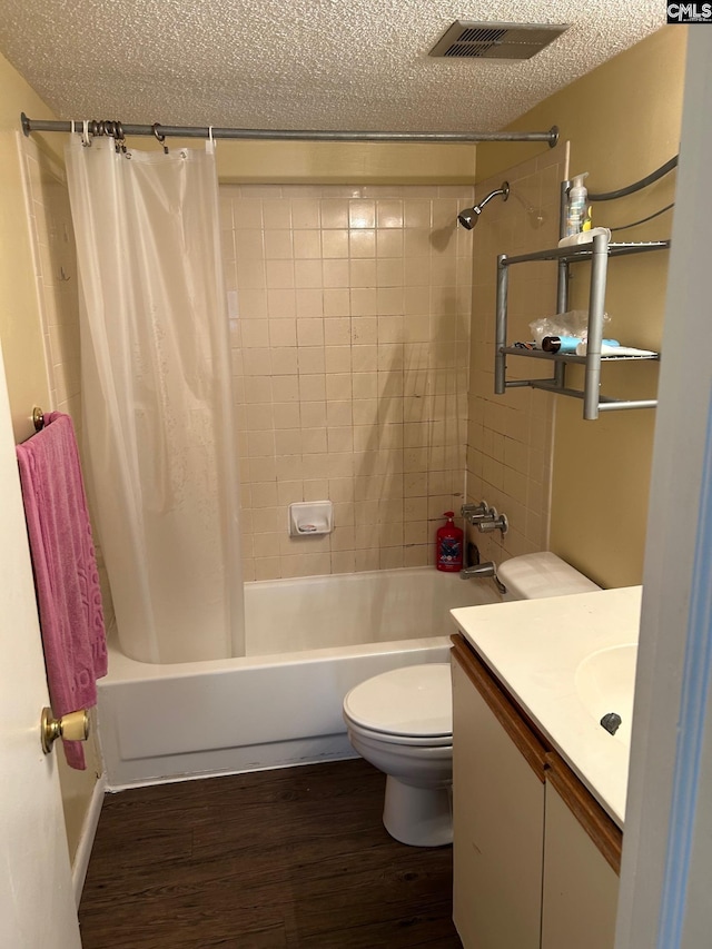 1600 Park Cir Unit 802, Columbia, SC 29201 - full bath featuring wood finished floors, shower / bathtub combination with curtain, a textured ceiling, toilet, and vanity