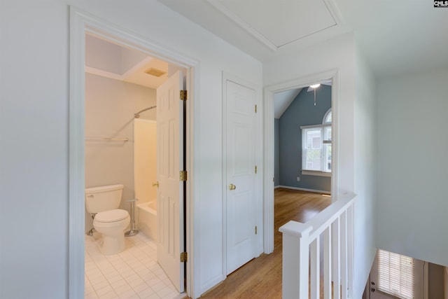920 Woodrow St Unit 1, Columbia, SC 29205 - hallway featuring light wood-style flooring, attic access, and vaulted ceiling