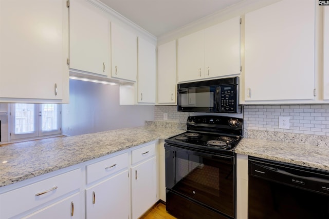 920 Woodrow St Unit 1, Columbia, SC 29205 - kitchen with black appliances, white cabinetry, decorative backsplash, and crown molding