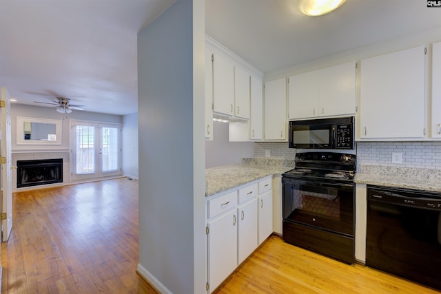 920 Woodrow St Unit 1, Columbia, SC 29205 - kitchen with black appliances, backsplash, ceiling fan, and light wood-type flooring