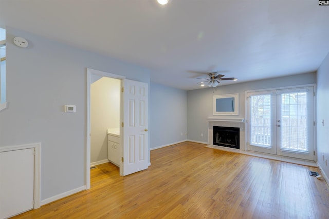 920 Woodrow St Unit 1, Columbia, SC 29205 - unfurnished living room featuring ceiling fan, light wood-style floors, baseboards, a tile fireplace, and recessed lighting