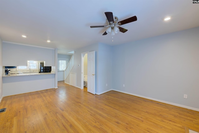 920 Woodrow St Unit 1, Columbia, SC 29205 - unfurnished living room featuring a ceiling fan, light wood finished floors, recessed lighting, and baseboards