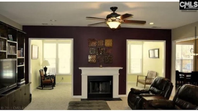 28 Calabash Ln, Elgin, SC 29045 - carpeted living area featuring ceiling fan, a fireplace with flush hearth, plenty of natural light, and recessed lighting