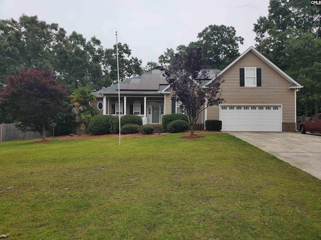 28 Calabash Ln, Elgin, SC 29045 - view of front facade featuring roof mounted solar panels, a garage, driveway, and covered porch