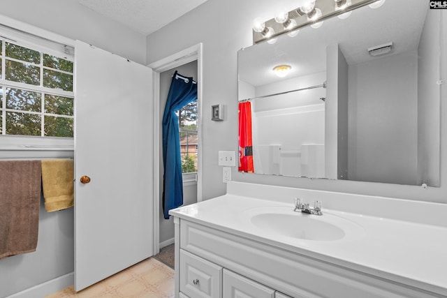 1908 Grays Inn Rd, Columbia, SC 29210 - full bath with vanity, tile patterned floors, a shower with shower curtain, and baseboards