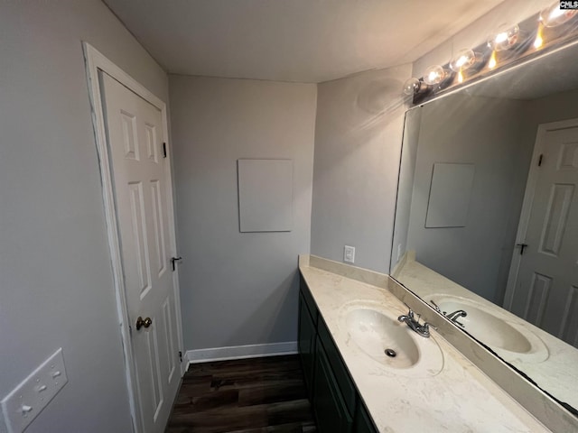 1850 Atlantic Dr, Columbia, SC 29210 - bathroom with wood finished floors, vanity, and baseboards