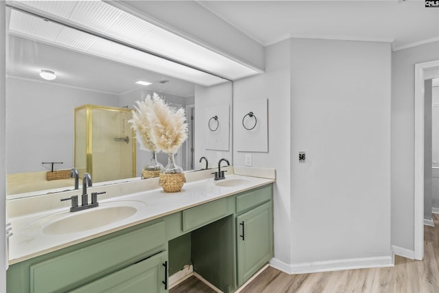 1850 Atlantic Dr, Columbia, SC 29210 - full bathroom with wood finished floors, a stall shower, double vanity, crown molding, and baseboards