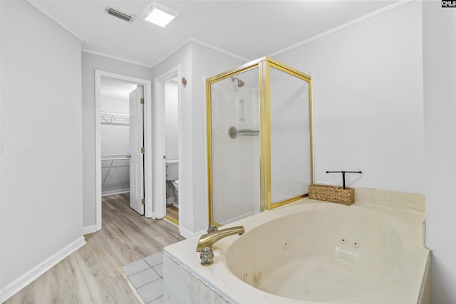 1850 Atlantic Dr, Columbia, SC 29210 - full bathroom with a stall shower, a tub with jets, toilet, wood finished floors, and crown molding