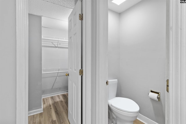1850 Atlantic Dr, Columbia, SC 29210 - bathroom featuring toilet, wood finished floors, and baseboards