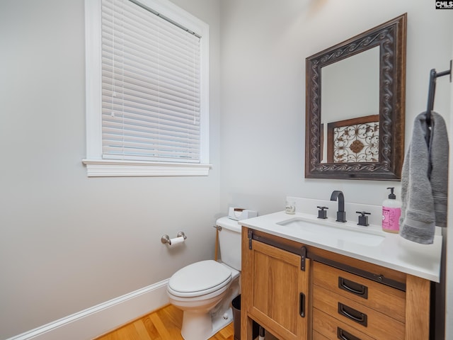 321 Lake Carolina Blvd, Columbia, SC 29229 - half bath with vanity, toilet, and wood finished floors