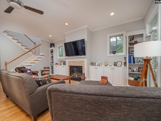 321 Lake Carolina Blvd, Columbia, SC 29229 - living area featuring a ceiling fan, plenty of natural light, ornamental molding, light wood-style flooring, and stairs
