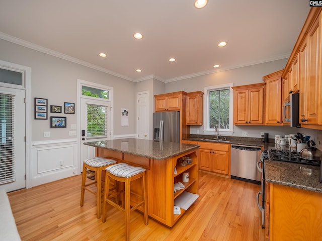 321 Lake Carolina Blvd, Columbia, SC 29229 - kitchen featuring appliances with stainless steel finishes, a kitchen island, a sink, open shelves, and light wood-style flooring