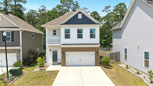 514 Red Taffy Way, Lexington, SC 29073 - view of front of home with a garage, a shingled roof, driveway, brick siding, and a balcony