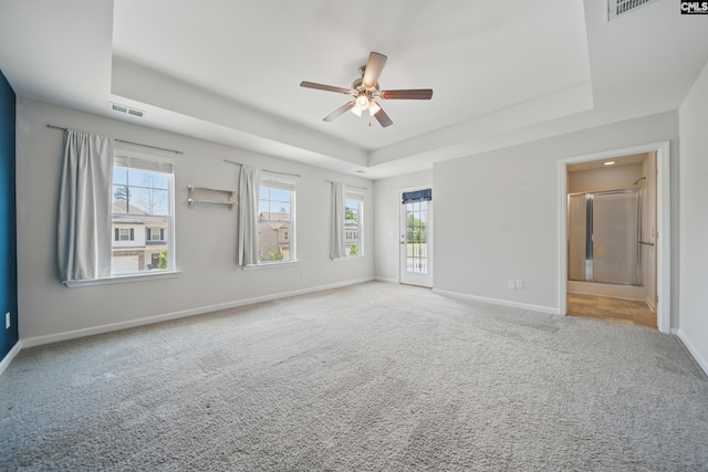 514 Red Taffy Way, Lexington, SC 29073 - carpeted spare room with a tray ceiling, ceiling fan, and baseboards