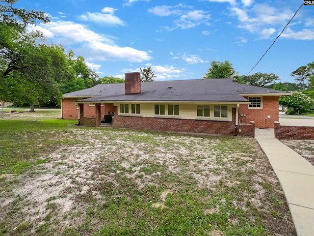 2540 Chatsworth Rd, Columbia, SC 29223 - back of property featuring brick siding, a chimney, and a yard