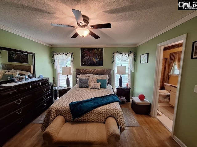2279TICKLEHIL Tickle Hill Rd, Camden, SC 29020 - bedroom with wood finished floors, multiple windows, a textured ceiling, crown molding, and ensuite bath