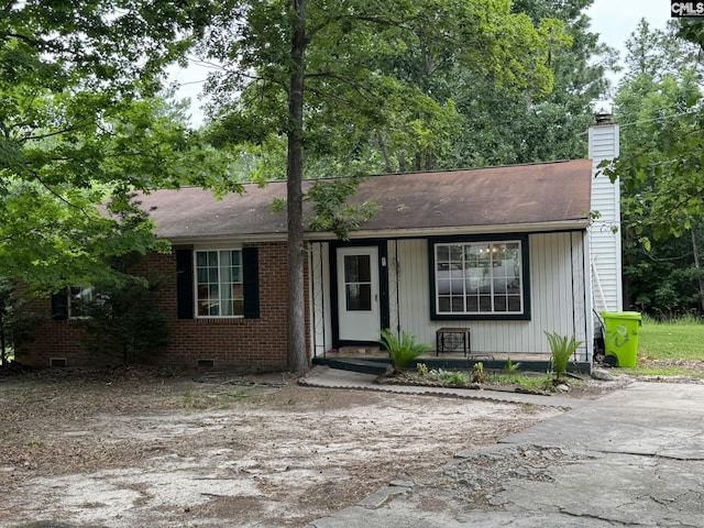 21 Forestgate Ct, Columbia, SC 29212 - view of front of home with a chimney, a porch, and crawl space