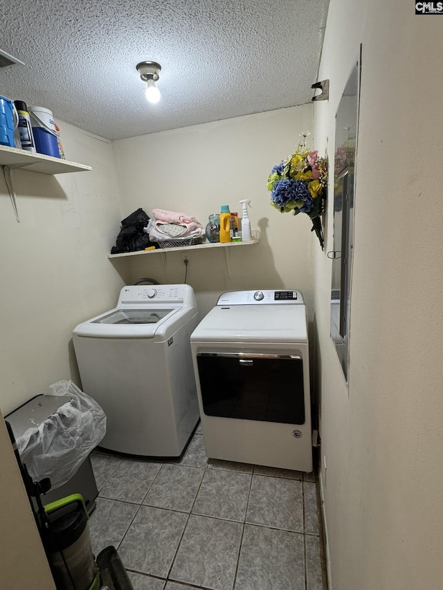 21 Forestgate Ct, Columbia, SC 29212 - washroom with washer and clothes dryer, a textured ceiling, and tile patterned flooring