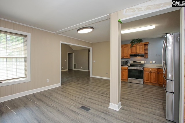 173 Rosewood Ln, Lexington, SC 29072 - kitchen with appliances with stainless steel finishes, baseboards, wood finished floors, brown cabinetry, and crown molding
