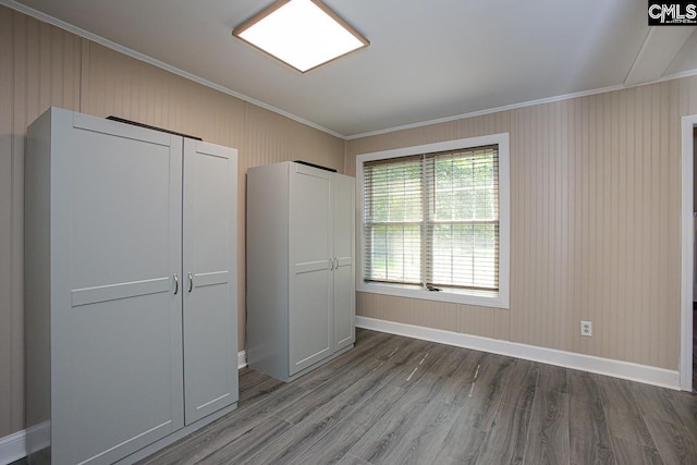 173 Rosewood Ln, Lexington, SC 29072 - unfurnished bedroom featuring crown molding, wood finished floors, and baseboards