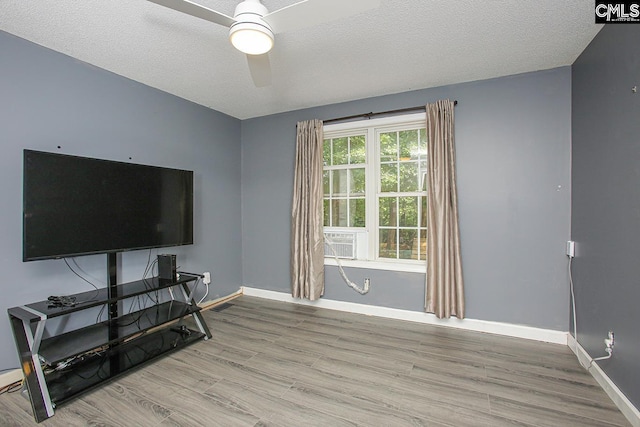173 Rosewood Ln, Lexington, SC 29072 - living room featuring wood finished floors, a ceiling fan, baseboards, cooling unit, and a textured ceiling