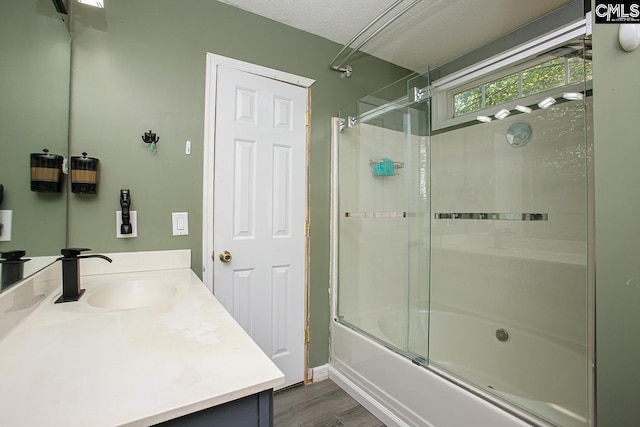 173 Rosewood Ln, Lexington, SC 29072 - full bathroom with vanity, shower / bath combination with glass door, wood finished floors, and a textured ceiling
