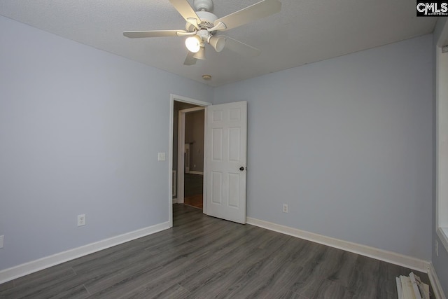 173 Rosewood Ln, Lexington, SC 29072 - empty room with dark wood finished floors, baseboards, and a ceiling fan
