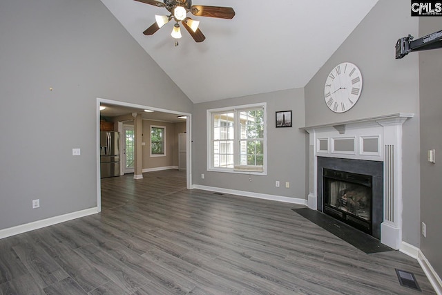 173 Rosewood Ln, Lexington, SC 29072 - unfurnished living room featuring high vaulted ceiling, a ceiling fan, wood finished floors, a fireplace with flush hearth, and baseboards