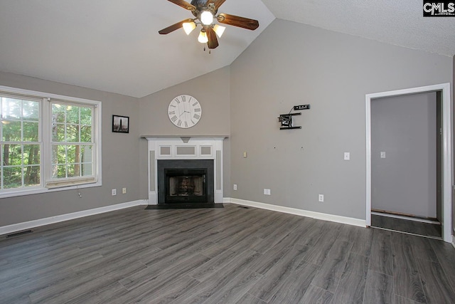 173 Rosewood Ln, Lexington, SC 29072 - unfurnished living room with a ceiling fan, dark wood finished floors, a fireplace with flush hearth, high vaulted ceiling, and baseboards
