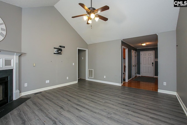 173 Rosewood Ln, Lexington, SC 29072 - unfurnished living room featuring a ceiling fan, a fireplace with flush hearth, baseboards, wood finished floors, and high vaulted ceiling