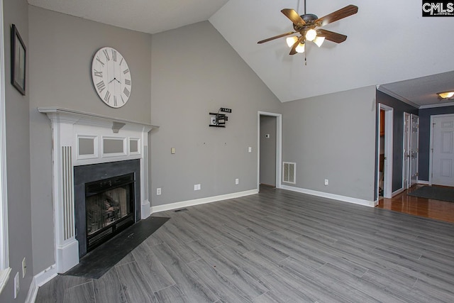 173 Rosewood Ln, Lexington, SC 29072 - unfurnished living room featuring a ceiling fan, lofted ceiling, a fireplace with flush hearth, baseboards, and wood finished floors