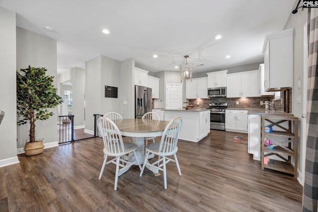 556 Harbour Pointe Dr, Columbia, SC 29229 - dining room featuring dark wood-style flooring, recessed lighting, baseboards, and a chandelier