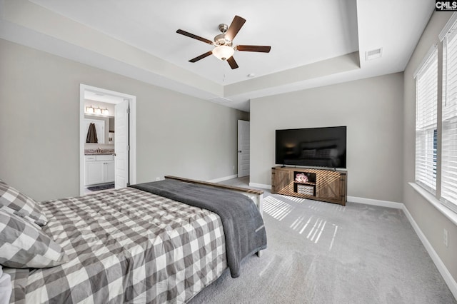 556 Harbour Pointe Dr, Columbia, SC 29229 - bedroom featuring a tray ceiling, multiple windows, carpet, and baseboards