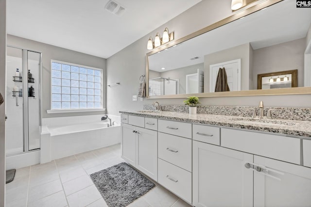 556 Harbour Pointe Dr, Columbia, SC 29229 - full bath with double vanity, a stall shower, a garden tub, and tile patterned flooring