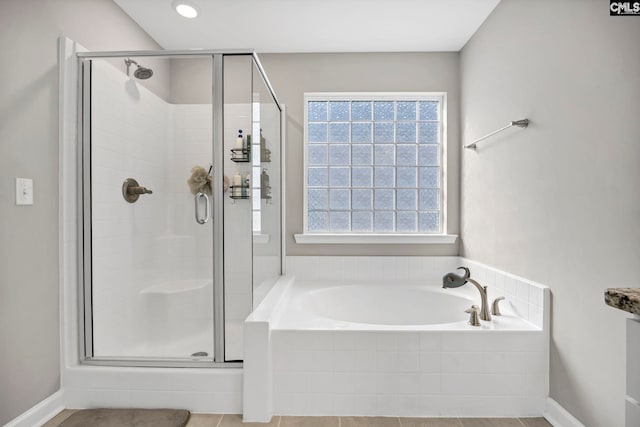 556 Harbour Pointe Dr, Columbia, SC 29229 - bathroom with a bath, a shower stall, and baseboards