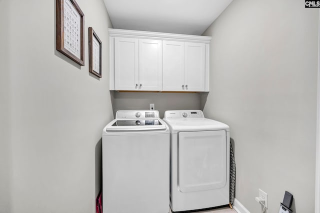 556 Harbour Pointe Dr, Columbia, SC 29229 - laundry area featuring cabinet space, washer and dryer, and baseboards