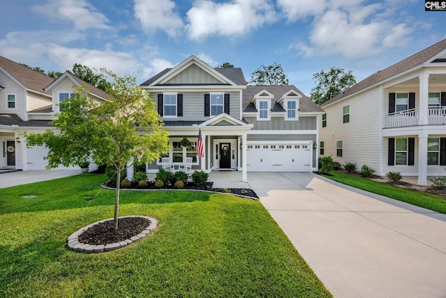 556 Harbour Pointe Dr, Columbia, SC 29229 - view of front of property with board and batten siding, concrete driveway, a front lawn, and covered porch