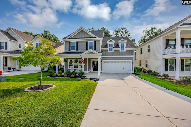 556 Harbour Pointe Dr, Columbia, SC 29229 - view of front of property featuring board and batten siding, concrete driveway, a front lawn, a porch, and a garage